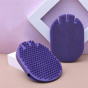 Purple massaging pet shampoo brush with soft bristles for grooming and bathing pets comfortably.